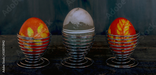 Traditional easter eggs on dark background and rustic cloth