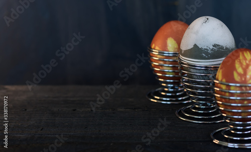 Traditional easter eggs on dark background and rustic cloth