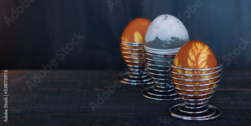 Traditional easter eggs on dark background and rustic cloth