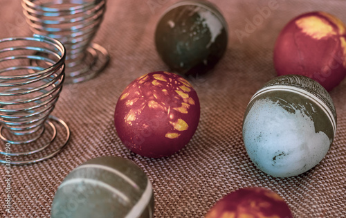 Traditional easter eggs on dark background and rustic cloth