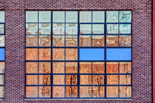 Industrial red brick facade in west side of Manhattan in New York.