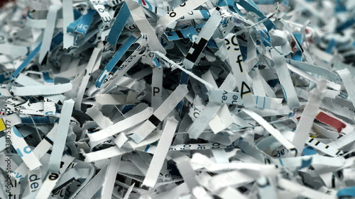 paper scraps of shredded documents seen in detail. Conceptual image for privacy, fake news photo