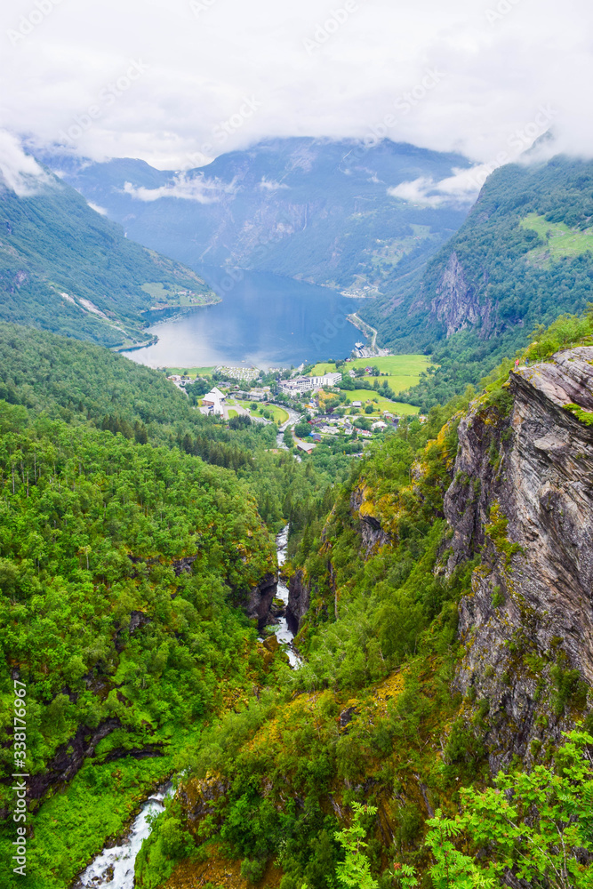 The landscape of Geiranger small village which is located at the end of the Geirangerfjord and where the Geirangelva river empties into it.