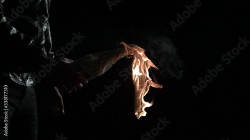 Extreme slow motion shot of a burning molotov cocktail.  photo