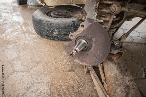 Fotografie Exposed or stripped wheel axle of a car, the place where usually hub with bearings sit and turn
