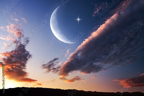 Canvas Print Moon in bright clouds of sunset sun
