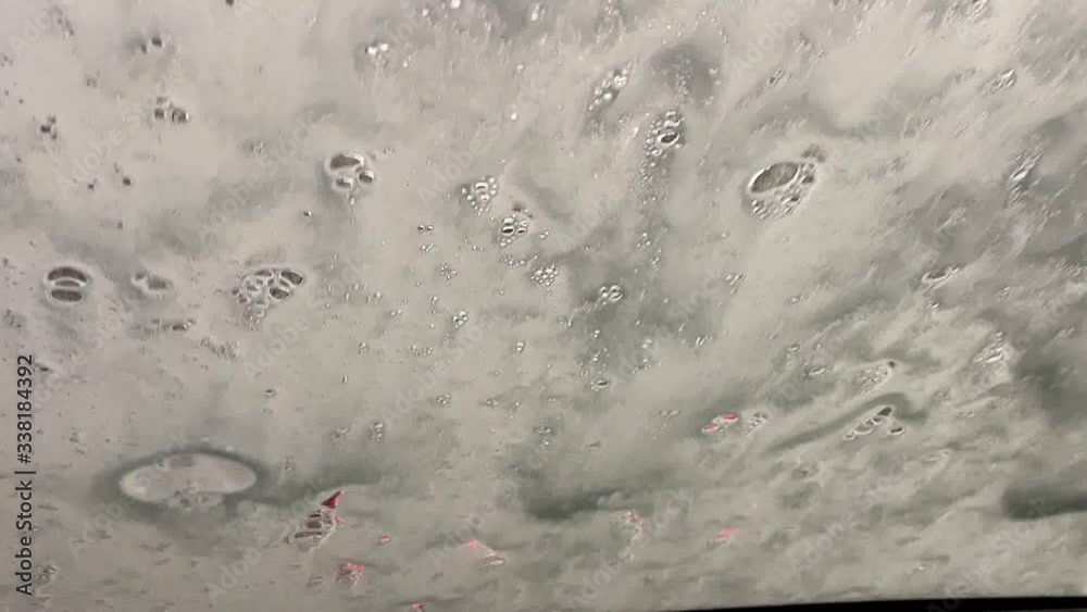Automatic car wash in action. View from the driver's seat