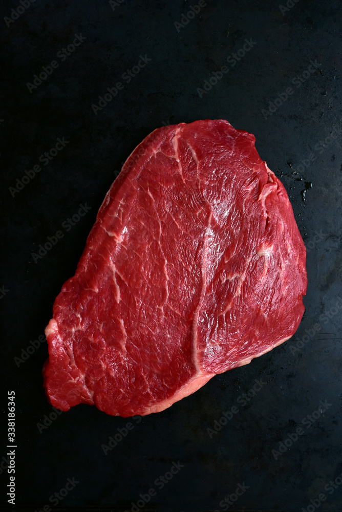 Fresh raw marbled beefsteak. Top view with copy space.