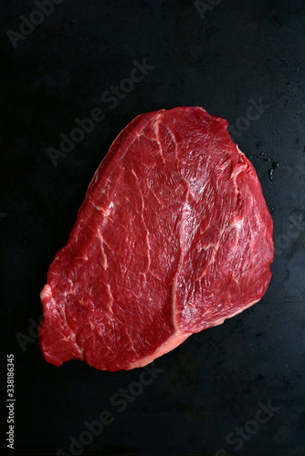 Fresh raw marbled beefsteak. Top view with copy space.