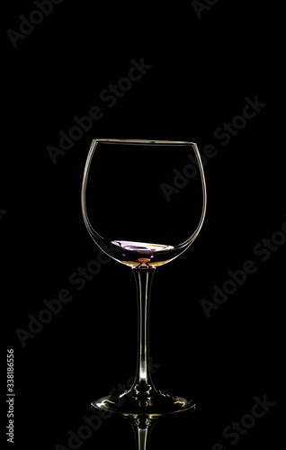 Glass of wine in black background