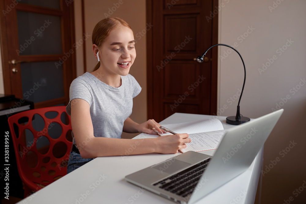 Young girl study online with laptop computer at home. Education, technology and home project Young girl study online with laptop computer at home. Education, technology and home project
