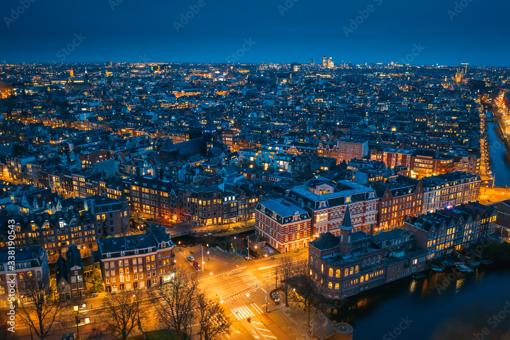 Amsterdam night city skyline aerial view from above, Amsterdam, Netherlands.