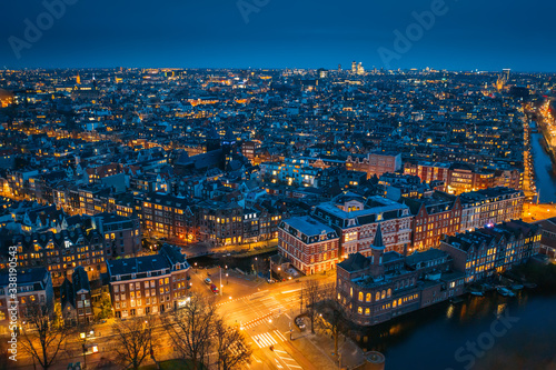 Amsterdam night city skyline aerial view from above, Amsterdam, Netherlands.
