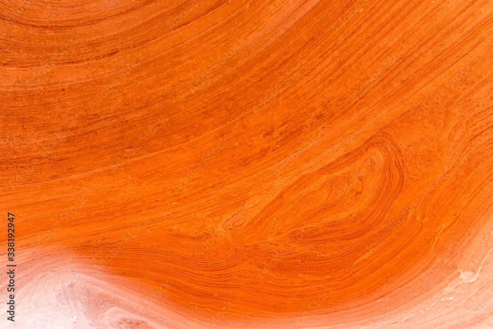 Obraz premium Bright orange colorful sandstone abstract closeup of rock formations at Antelope slot canyon in Arizona on trail from Lake Powell with lines and shapes