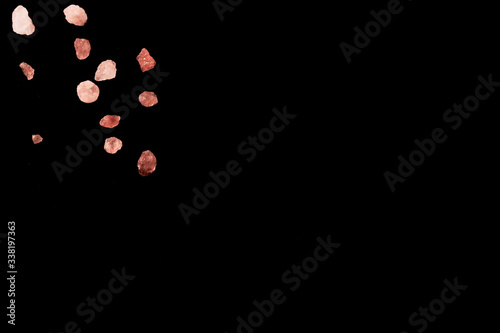 Macro photography of Himalaya salt isolated on black background with copy space