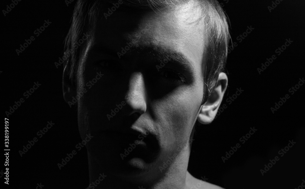 black and white dramatic portrait of a guy