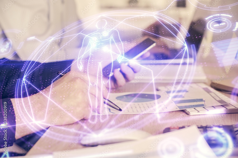 Double exposure of man's hands holding and using a phone and education theme drawing. Double exposure of man's hands holding and using a phone and education theme drawing.