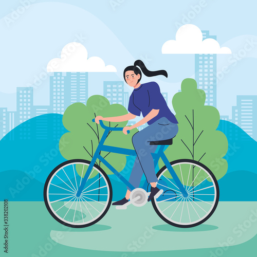 young woman riding bike in cityscape vector illustration design