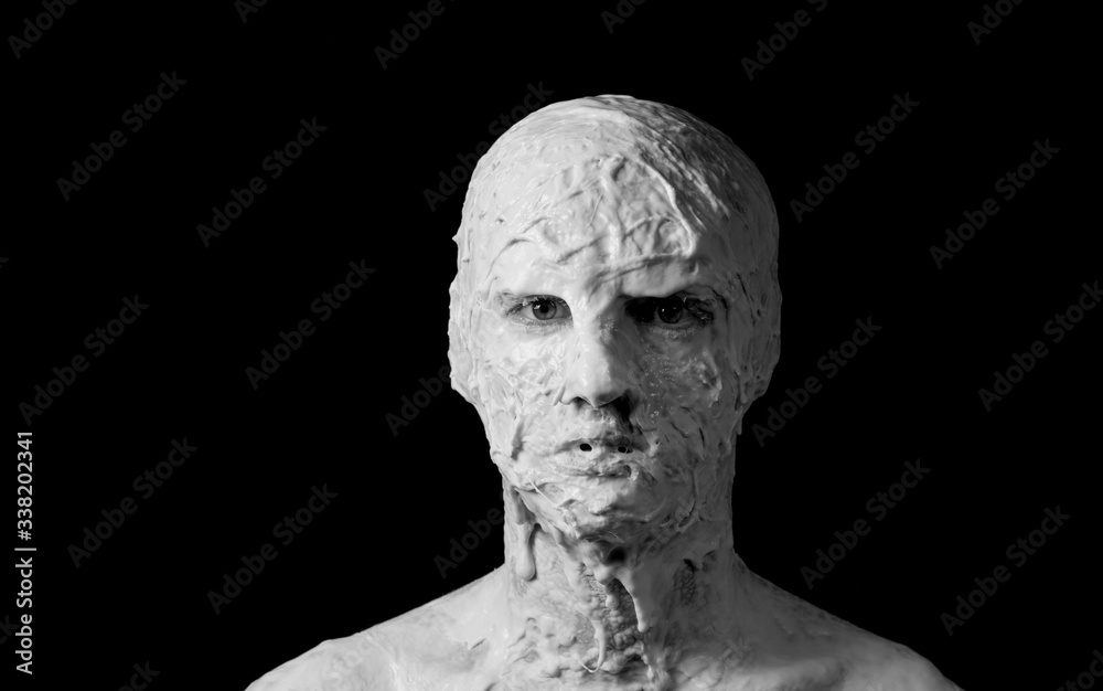 portrait of a shapeless distorted face on a black background portrait of a shapeless distorted face on a black background