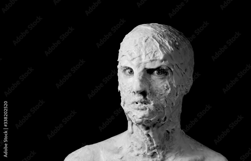 portrait of a shapeless distorted face on a black background portrait of a shapeless distorted face on a black background