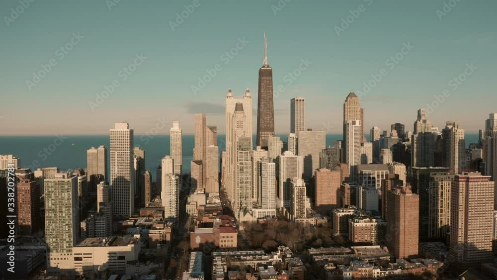 Flying towards tall skyscrapers in Chicago Downtown, late afternoon light Flying towards tall skyscrapers in Chicago Downtown, late afternoon light