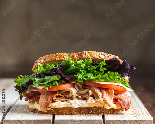 BLT sandwich on wooden surface