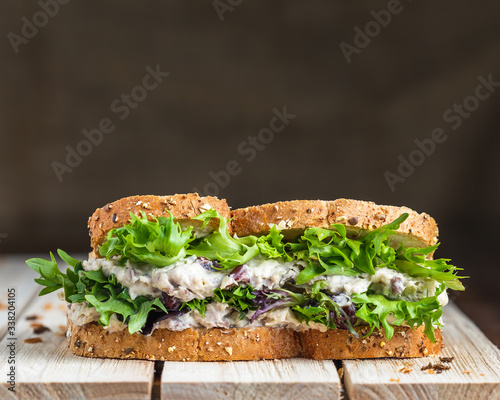 Tuna and lettuce on wooden surface
