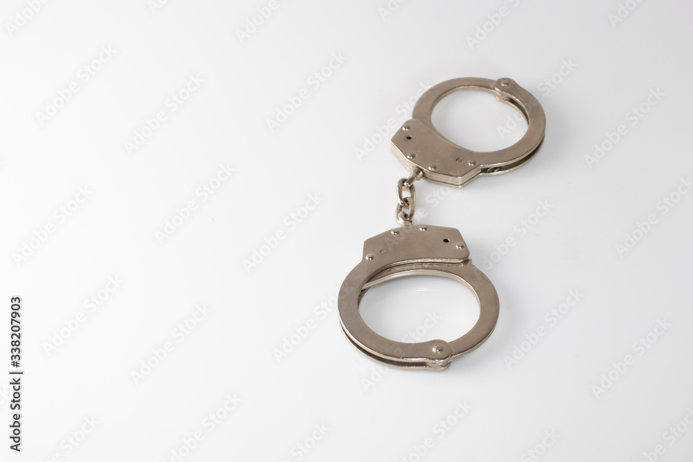 steel metal Handcuffs on white background isolate steel metal Handcuffs on white background isolate