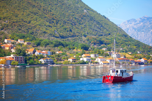 scenery with red yacht in the sea bay