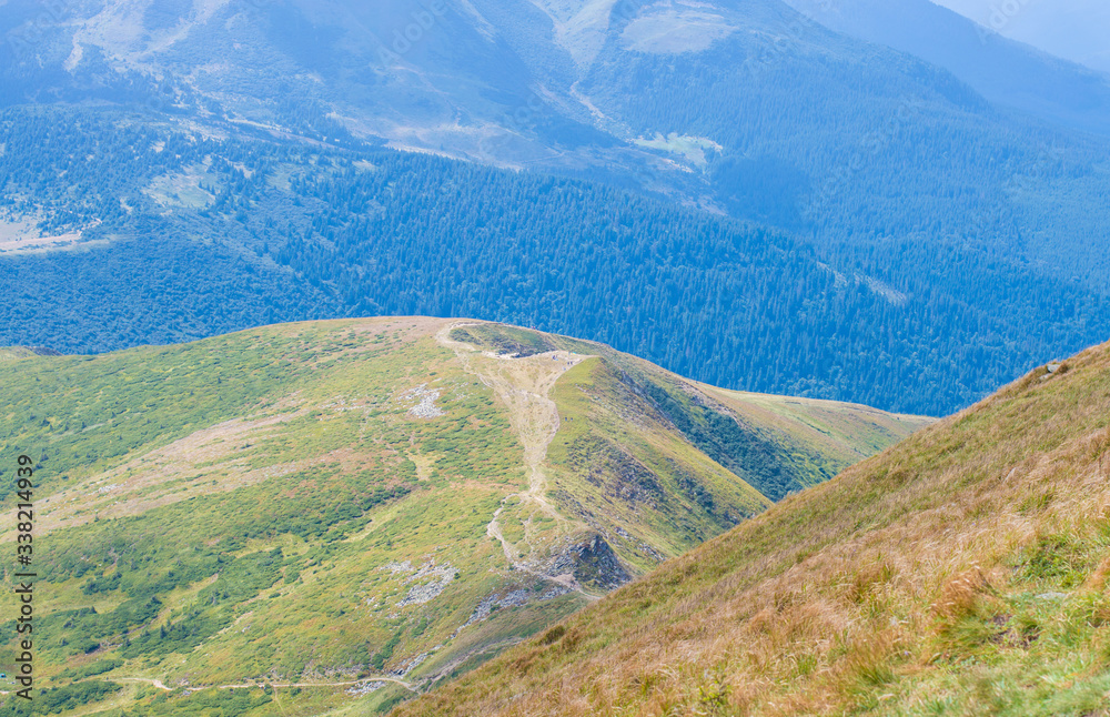 mountain slopes in with green meadow mountain slopes in with green meadow