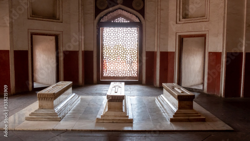 three stone sarcophagus and a window at humayun's tomb in delhi