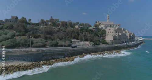 Tel Aviv - Jaffa. Aerial Drone footage. Fly towards saint peter's church in Jaffa to Tel Aviv beaches and Skyline cityscape