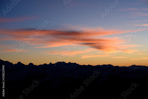 Silhouette of a swiss mountain range at sunrise