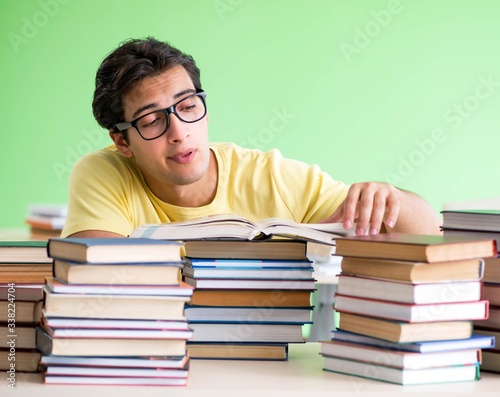 Student with too many books to read before exam