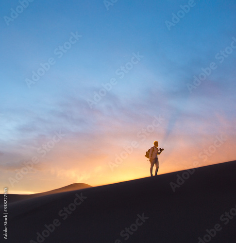 Photographer exploring Great Sand Dunes  Colorado