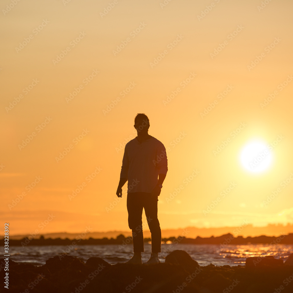 sunset portrait of a man by the ocean sunset portrait of a man by the ocean