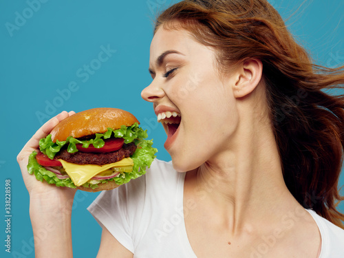 woman eating hamburger