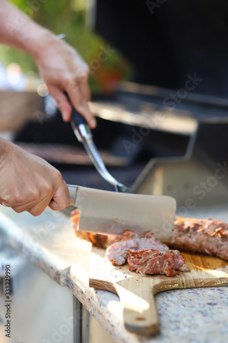 Cutting meat on a cutting board