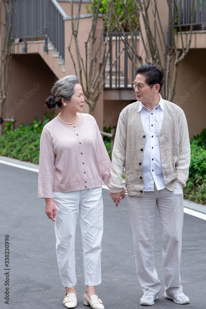 An Asian elderly couple walking An Asian elderly couple walking