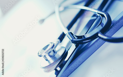 Medical equipment  blue stethoscope and tablet on white background. Medical equipment