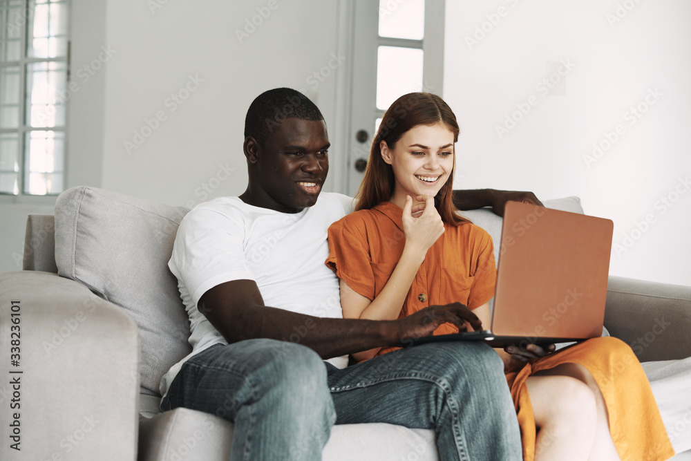 couple using laptop at home couple using laptop at home