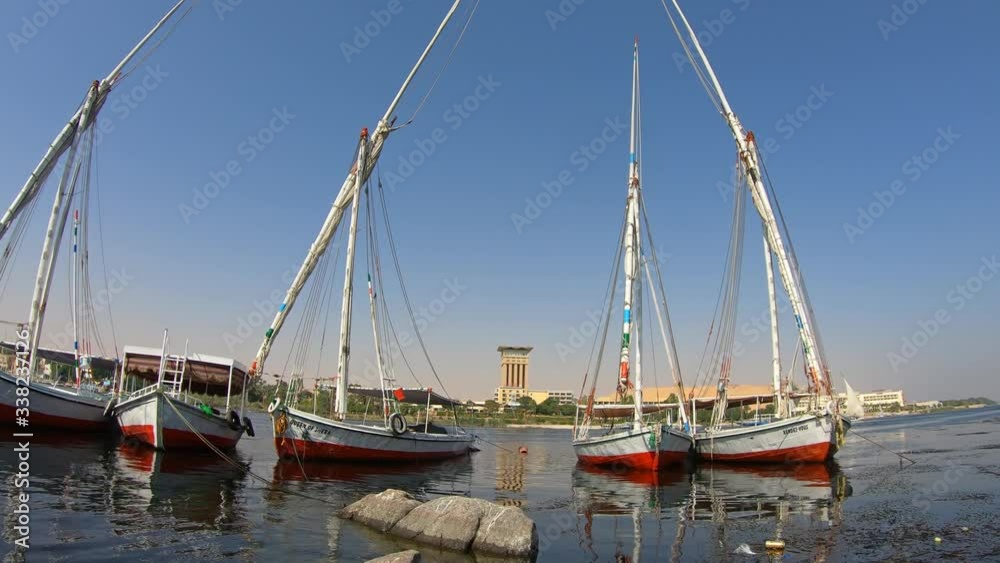 Egyptian felucca boats on the Nile River in Aswan, 4k Egyptian felucca boats on the Nile River in Aswan, 4k