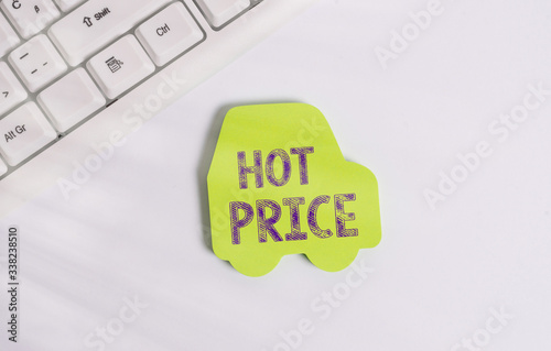 Word writing text Hot Price. Business photo showcasing Buyer or seller can obtain something for a product sold or buy Green note paper in the shape of the car. Copy space on the green note paper photo