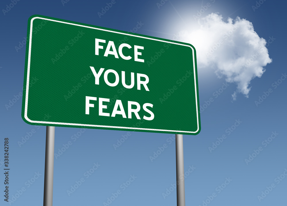 Face Your Fears sign for courage and bravery concept. Face Your Fears sign for courage and bravery concept.