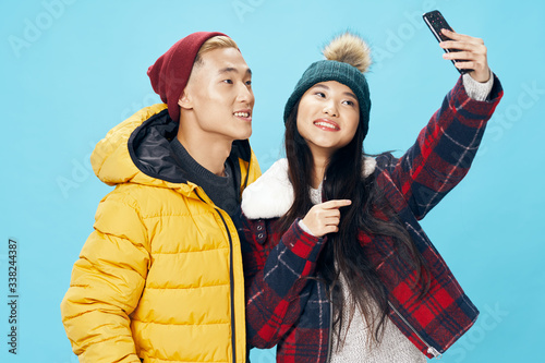 happy young couple in winter clothes