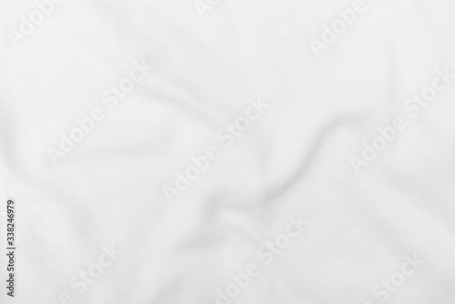 Abstract white fabric texture background. Wavy white cloth.