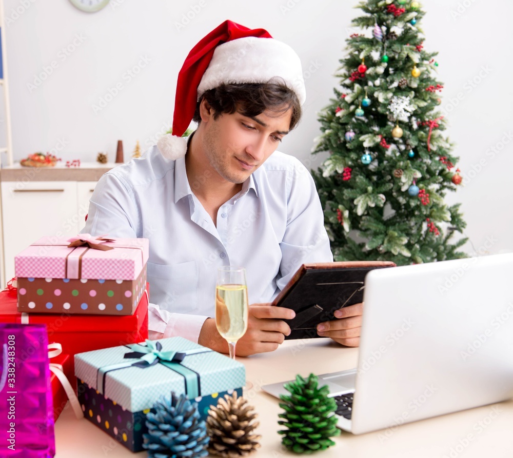 Young employee businessman in office christmas concept