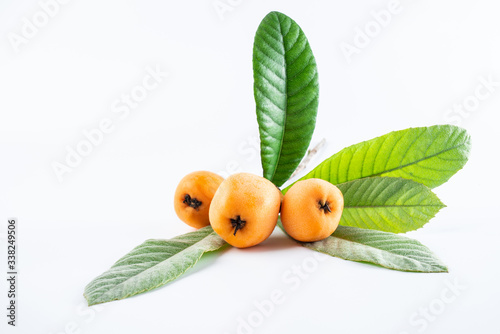 Fresh loquat fruit on white background photo