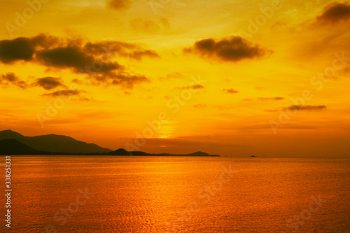 Sunset at sea with gold sky and island landscape background,Koh Samui ,Thailand