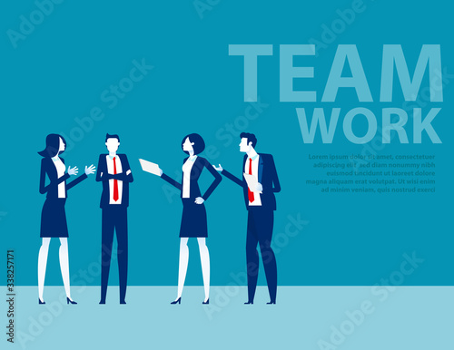 Team in office suit staanding toggether. Business people meeting and talking concept. Brainstorming
